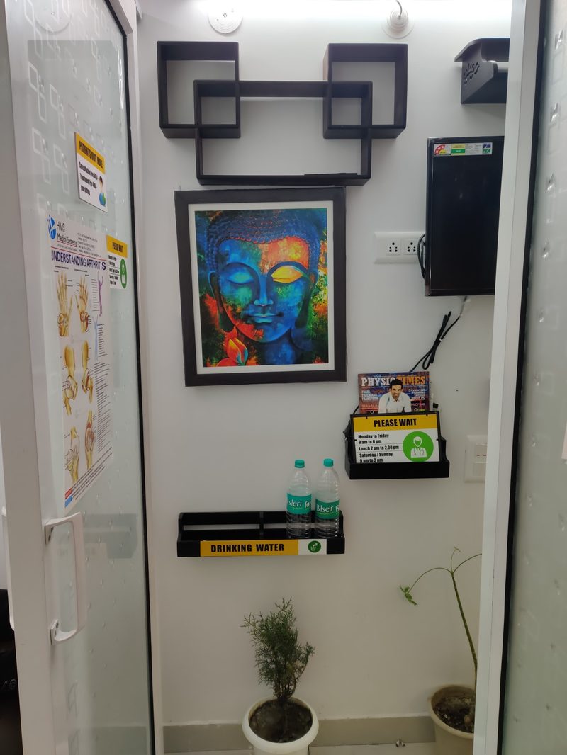 Rehabilitation gym equipment including kettlebells and exercise ball at Krishna Sports Physio