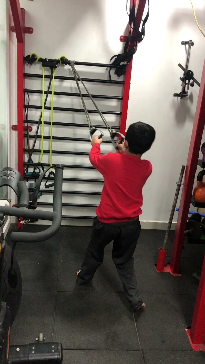 Patient doing rehabilitation exercises with resistance bands at Krishna Sports Physio